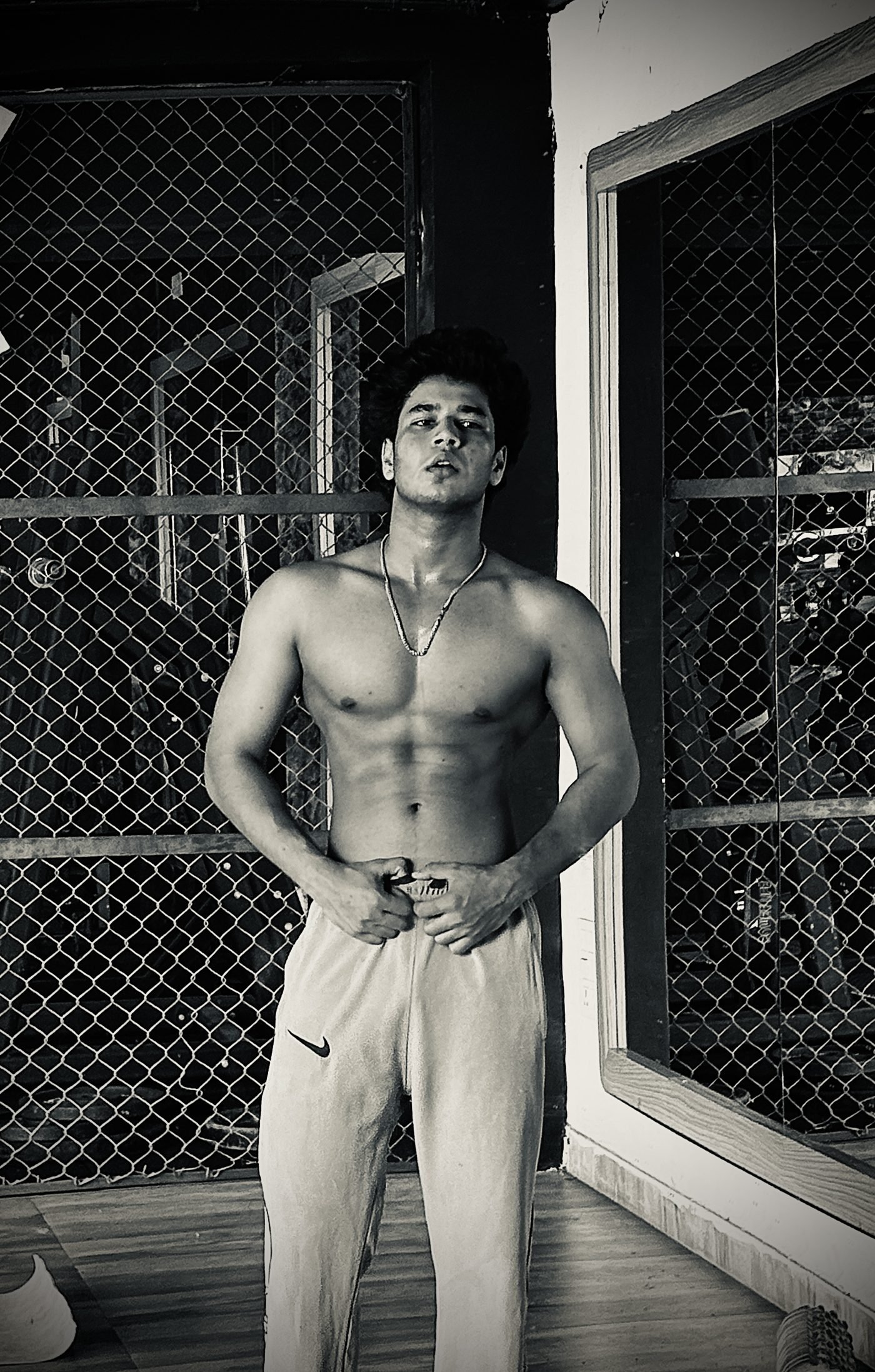 Masud Shaikh black and white gym portrait, hand grip